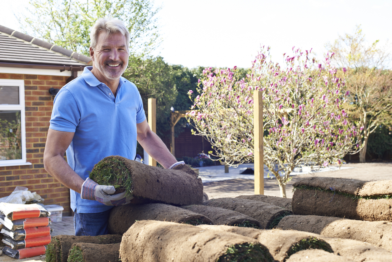 Gardener Laying Turf